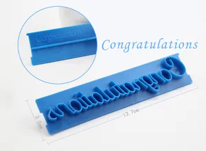 Close-up detail of Congratulations script fondant stamp mold for cake decorating