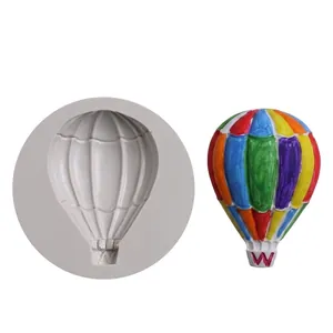 Detailed view of hot air balloon silicone mold with a colorful fondant balloon sample