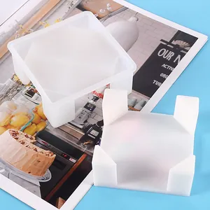 Detailed view of square white silicone molds for DIY resin storage boxes and coasters.