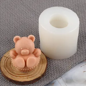 Detailed view of a 3D bear candle mold and its finished cartoon bear soap product
