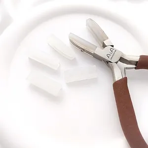 Macro detail of professional nylon jaw pliers and replacement tips for DIY jewelry making