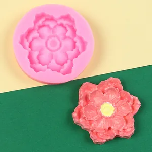 Detailed top view of a pink peony flower silicone mold with a finished resin craft piece