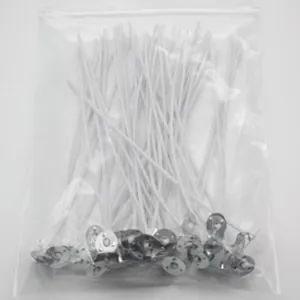 Bulk DIY cotton candle wicks with round metal bases packed in a clear plastic zip bag