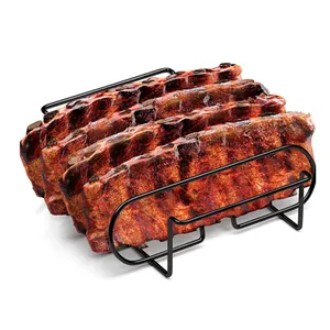 Detail view of a premium black metal rib rack holding four slabs of grilled BBQ spare ribs