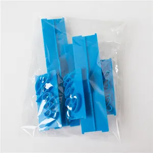Detailed view of 6pcs blue cursive script fondant stamps in clear plastic packaging.