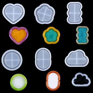Variety of DIY silicone resin molds showing both molds and colorful finished pieces