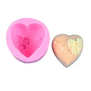 Pink heart-shaped silicone mold for DIY chocolate with floral patterns and Kiss text
