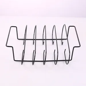 Detailed view of black multi-slot stainless steel rib rack for outdoor grilling