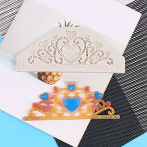 Detail view of a silicone heart crown mold and its colorful finished resin piece.