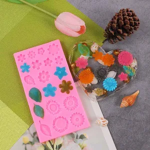 Detailed view of pink silicone mold featuring 3D flower and leaf patterns for DIY crafts