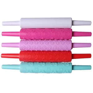 Set of five colorful plastic embossed rolling pins with flower patterns for baking