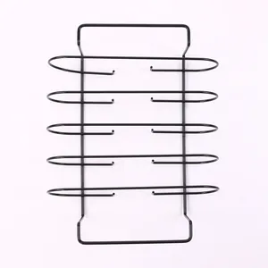 Macro detail view of a black heavy duty metal BBQ rib rack for outdoor grilling