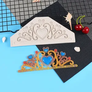 Close-up of heart crown lace silicone mold with a colorful finished fondant result