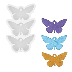 Stampo in silicone a farfalla per resina con ciondoli glitterati colorati finiti