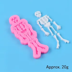 Detailed view of a pink Halloween skeleton silicone mold with precise size indicators