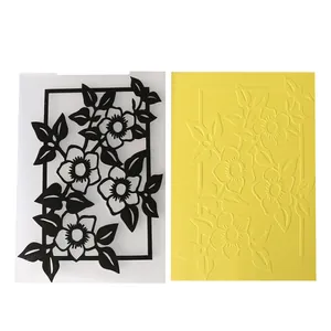 Detailed view of floral embossing folder and its embossed effect on yellow paper