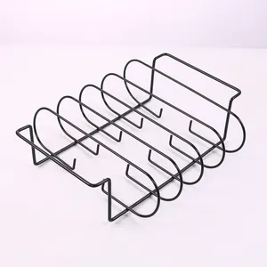 Close-up of black metal rib rack for grilling, featuring six slots and sturdy handles