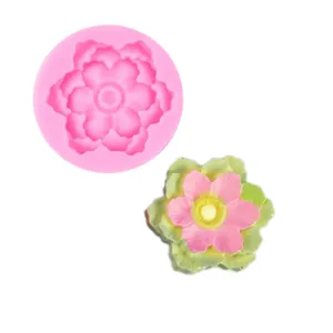 Detail view of pink sunflower silicone mold and its colorful resin finished flower product