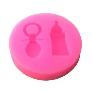 Detail of pink silicone mold with baby bottle and pacifier shapes for DIY crafts