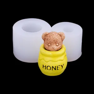 Detail showing teddy bear in a honey pot candle and its silicone mold