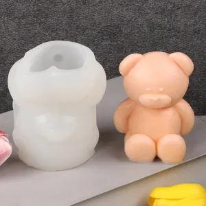 Detailed view of 3D bear silicone mold with a finished peach-colored bear candle