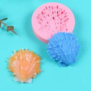 Detailed macro view of pink seashell silicone mold and its textured resin cast results.