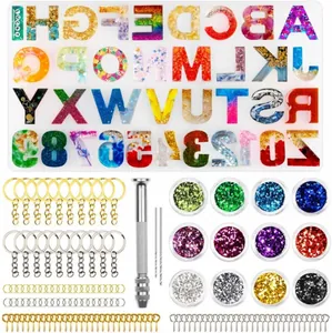 Complete DIY resin casting kit with alphabet mold, glitters, and keychain accessories.