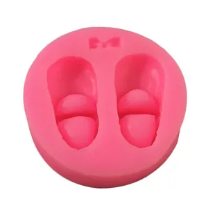 Detailed view of pink baby shoe shaped silicone mold for DIY resin and plaster handmade crafts