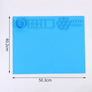 Large blue silicone craft mat with paint wells and brush holder, 50.3x40.2cm size