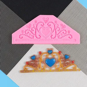 Detail showing pink heart crown silicone mold and finished amber resin product piece