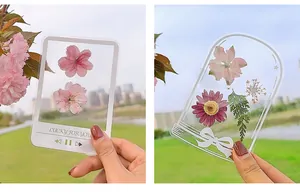 Detail of transparent DIY dried flower bookmarks with Polaroid and bell-shaped designs.