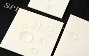 Close-up of waterproof transparent sticky notes showing water droplets on surface
