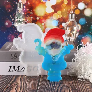 DIY Christmas Santa Claus silicone resin mold shown with a finished blue resin piece