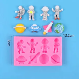 Detail showing space-themed silicone mold with astronaut and rocket shapes for DIY crafts.