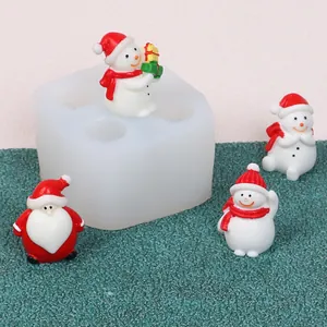 Detailed view of the DIY Christmas silicone mold with finished Santa and Snowman figurines.