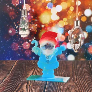 Detailed shot of handcrafted DIY epoxy resin Santa Claus desktop ornament on wood surface
