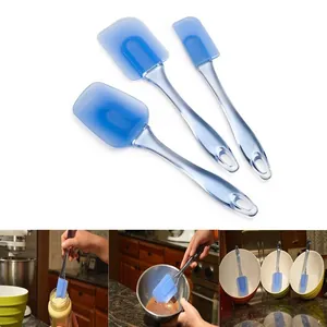 Macro detail of professional 3-piece blue silicone spatulas showing flexible heads and handles