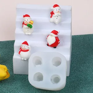 Detail of 4-cavity Christmas silicone mold for mini Santa and snowman candle making