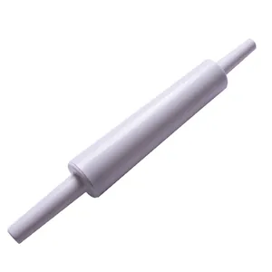 Macro detail of smooth white plastic rolling pin for fondant cake decorating.