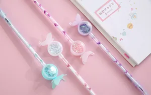 Close-up of butterfly gel pens with sequins and pastel colors for students