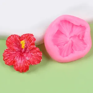 Detailed view of pink hibiscus flower silicone mold with a red resin finished sample