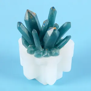 Detailed view of DIY crystal cluster silicone mold with blue resin finished product.