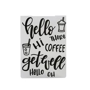 Detailed view of a white DIY embossing stencil with coffee icons and greeting text