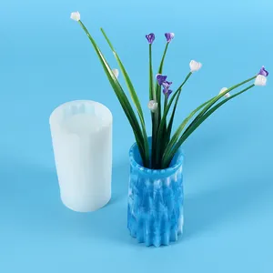 Detail of a translucent silicone mold next to a finished blue marbled resin vase