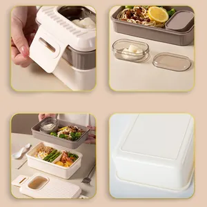 Detail view of a minimalist double-layer lunch box showing buckle and compartments.