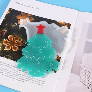 Detailed view of DIY Christmas tree silicone mold and finished green glitter resin