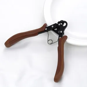 Detail of professional jewelry wire looping pliers with brown handles on white background