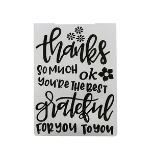 Detail of plastic embossing folder with 'thanks' and 'grateful' text for DIY crafts