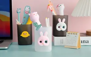 Detail view of cute cartoon animal pen holder desk organizers with rabbit and duck