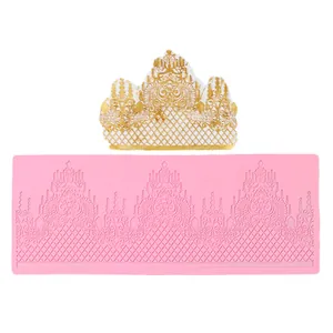 Detailed view of baroque lace cake border silicone mold with golden fondant sample.